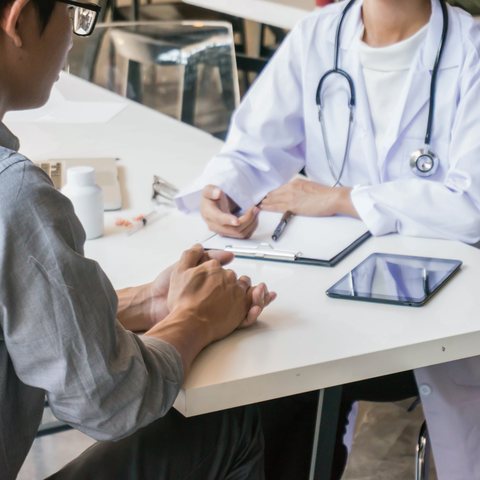 A patient talking through a treatment plan with a clinician