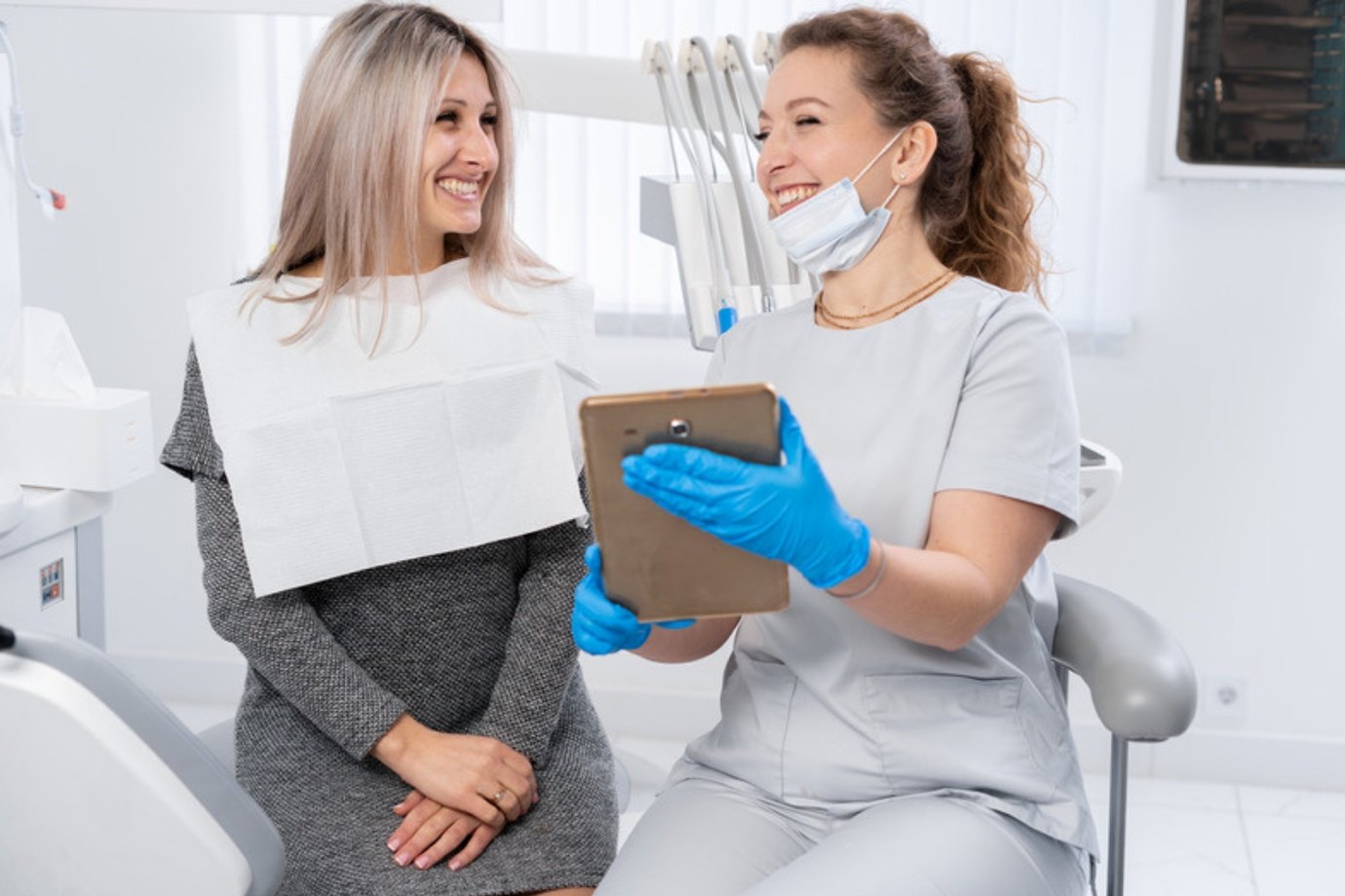 A patient and dentist going through a treatment plan together