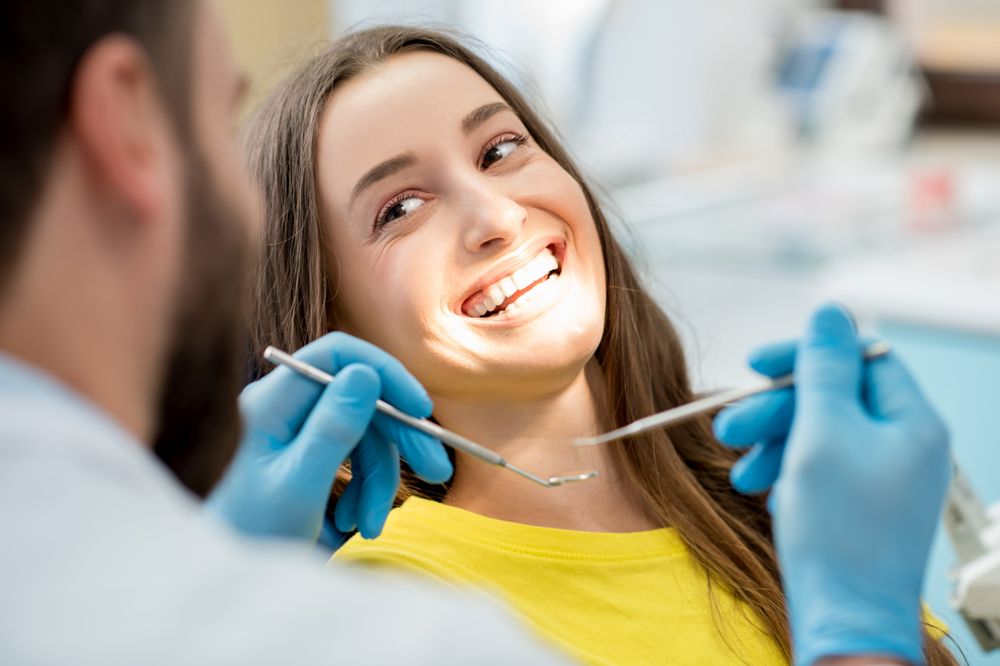 Woman smiling during a dental examination