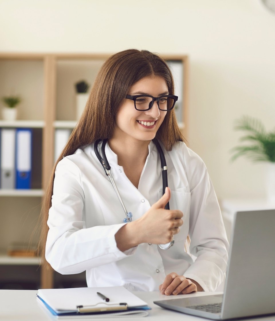 A clinician sending an enquiry from her laptop